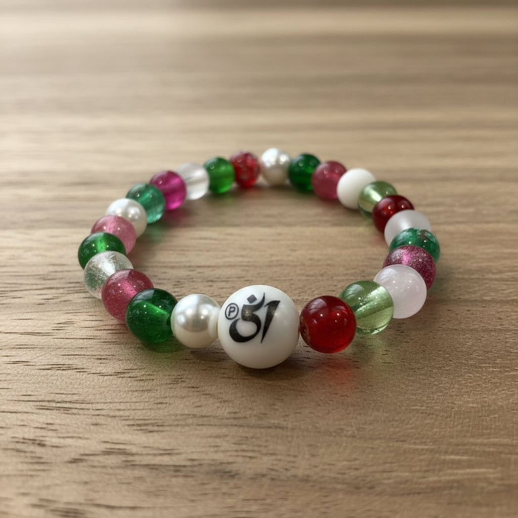 Multicolored beaded bracelet with a white bead featuring a symbol on a white background