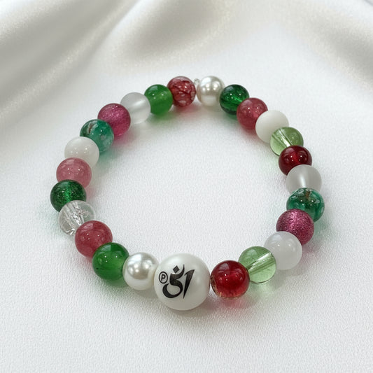 Colorful beaded bracelet with a central white bead featuring a symbol on a white background